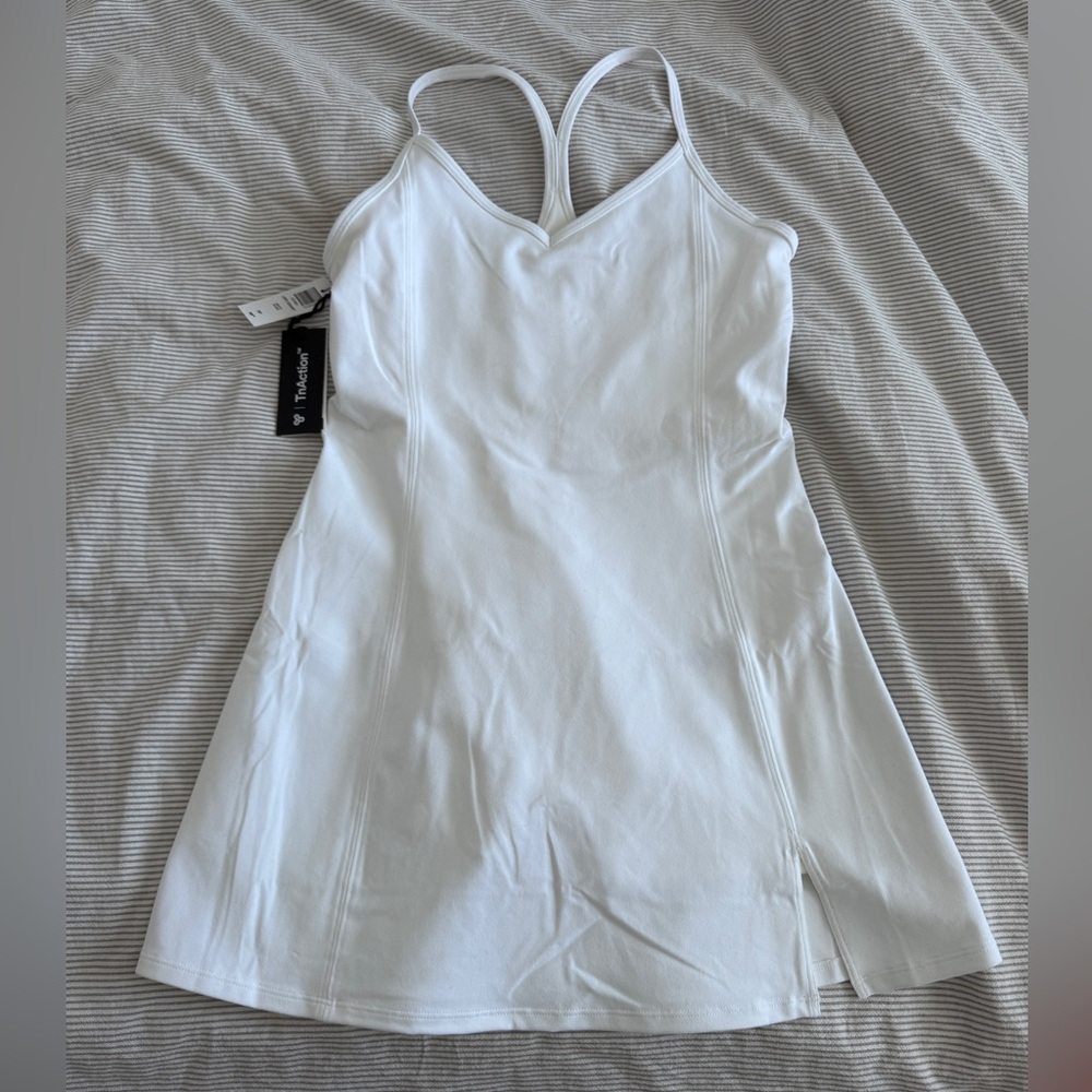 TNA Action tennis mini dress with built in shorts.
